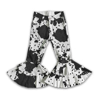 girls black and white cow print bell bottoms